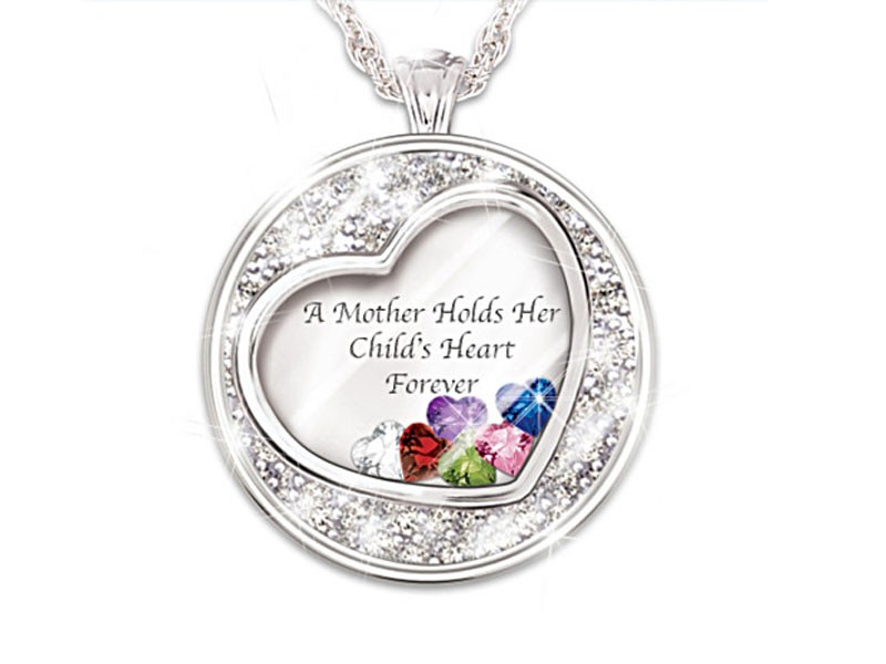 Mother Holds Her Child's Heart Birthstone Pendant With Names