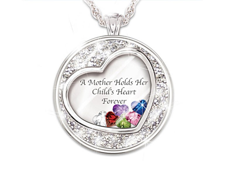 Mother Holds Her Child's Heart Birthstone Pendant With Names